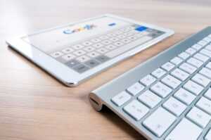 SEO image displays Google search page and a keyboard