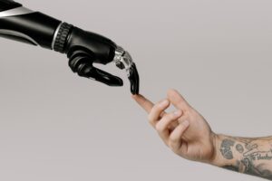 A robotic arm reaches out and touches a human hand, the AI version of "the creation of Adam" from the Sistine Chapel
